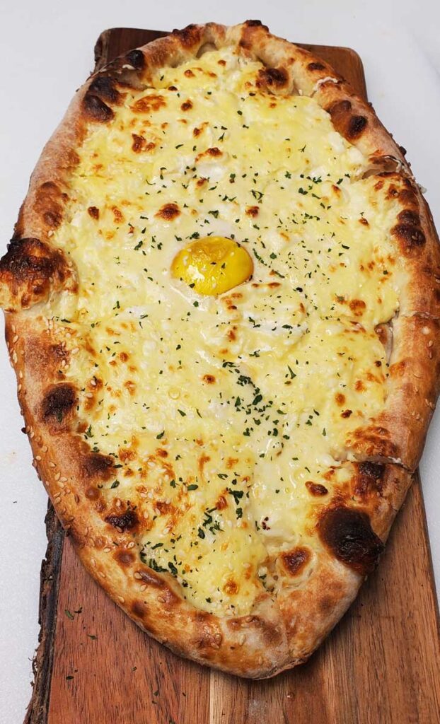 Boat shaped georgina pizza at Naples, Florida